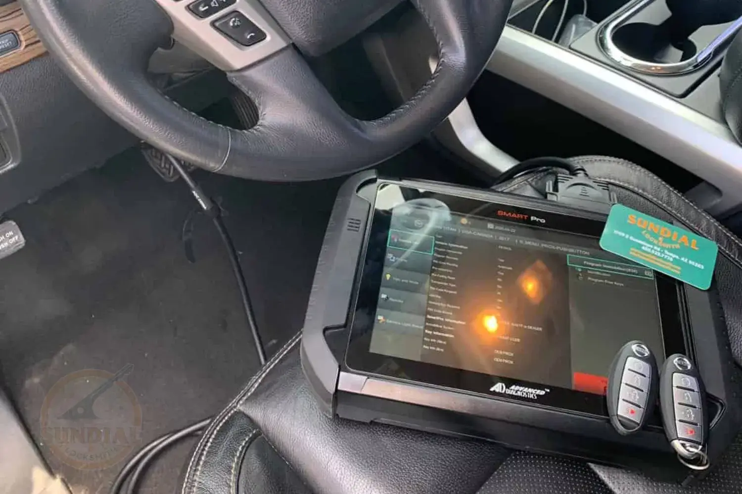 Technician programming key in Nissan vehicle