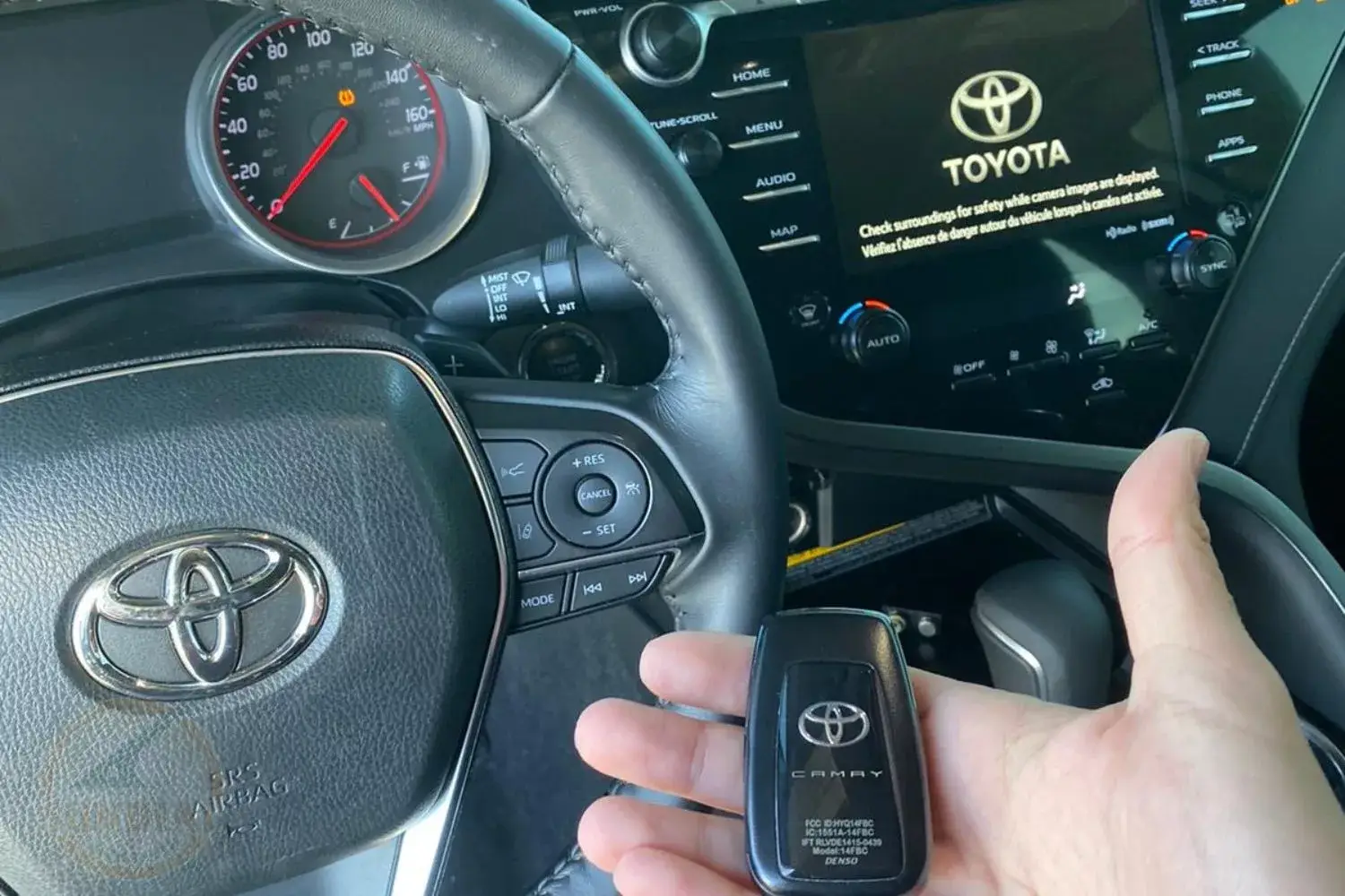 Interior view, Toyota car with infotainment system and key fob