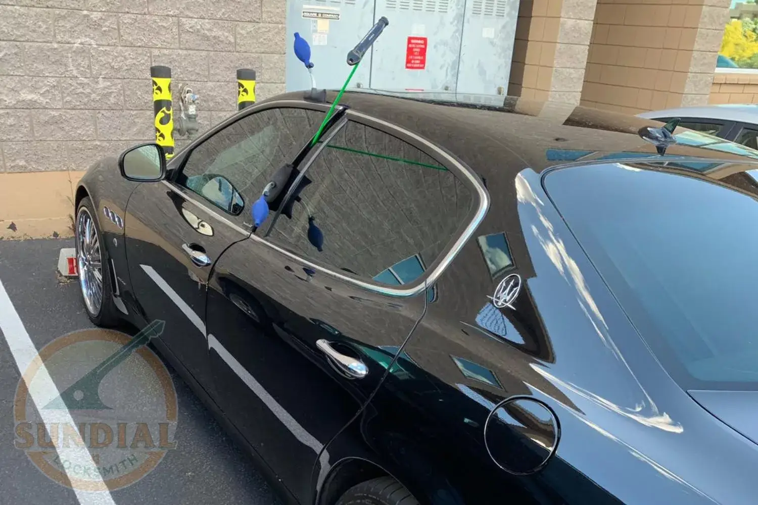 Locksmith aiding a car owner with a lockout