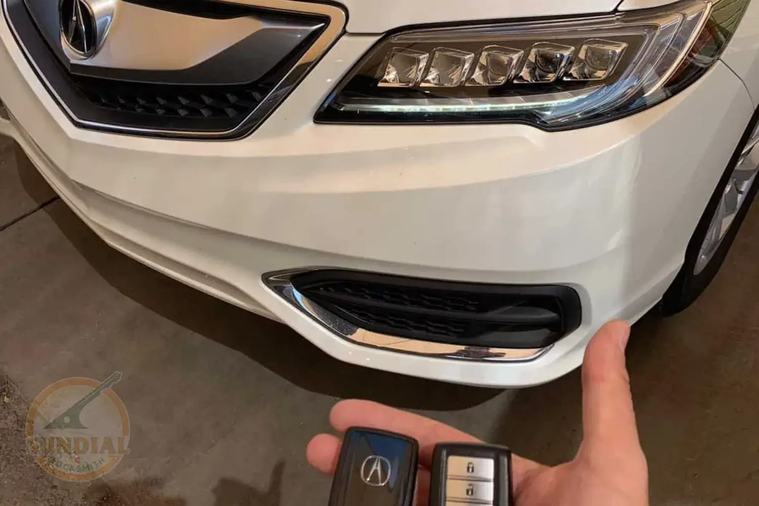 Person unlocking white car with key fob.