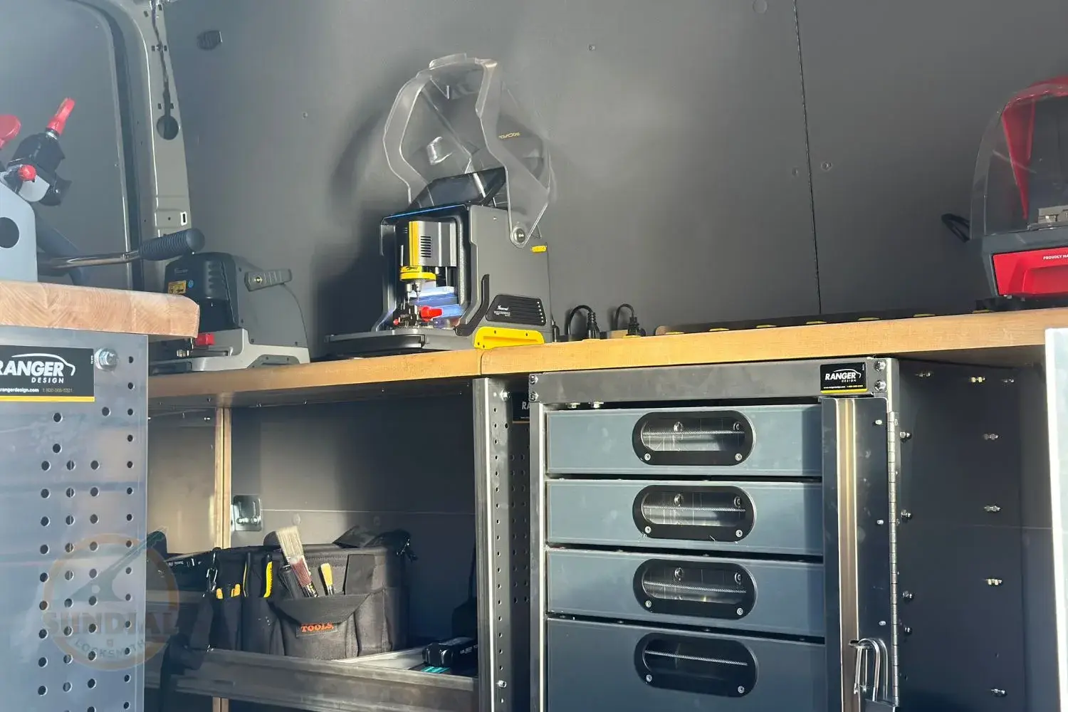 Organized vehicle toolbox with equipment and supplies.