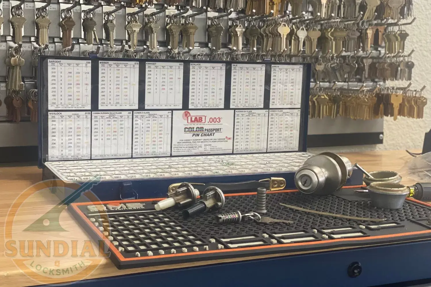 Sundial Locksmith technician engrossed in the detailed process of rekeying a lock in our Tempe shop.